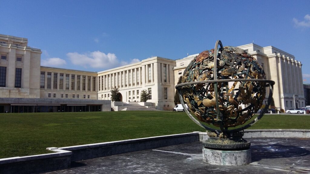 globe sculpture in front of the palace of nations in geneva switzerland