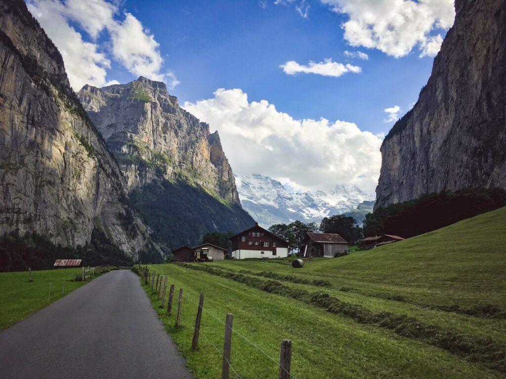 green grass with mountains in lauterbrunnen switzerland