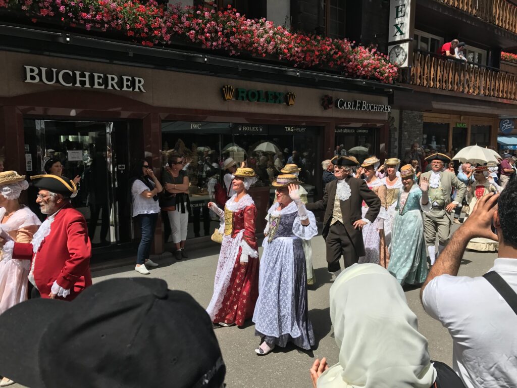 folklore festival outside on the main street in zermatt switzerland