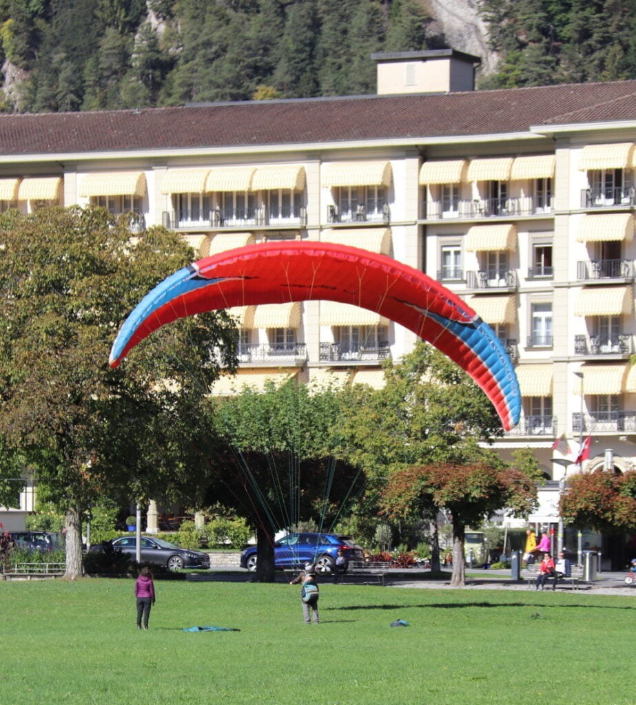 paragliding parachute on grass in interlaken switzerland